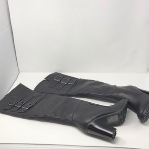 Women’s knee-high black leather boots